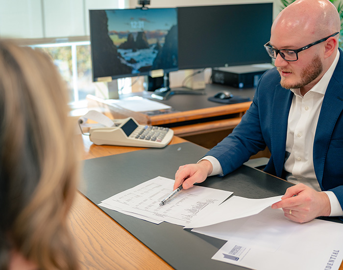 Umbreit, Wileczek & Associates account pointing out financial data to client